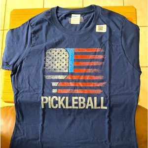 Brand new, size small men’s or woman, navy blue Pickleball T-shirt.
